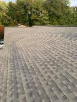 Residential roof with brown shingles